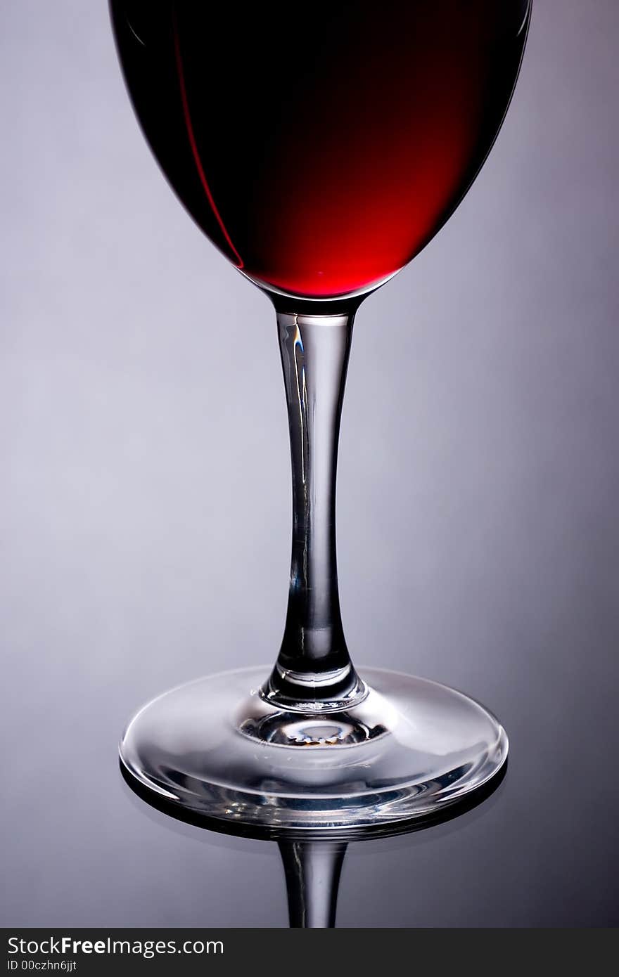 The close up of the red wine glass