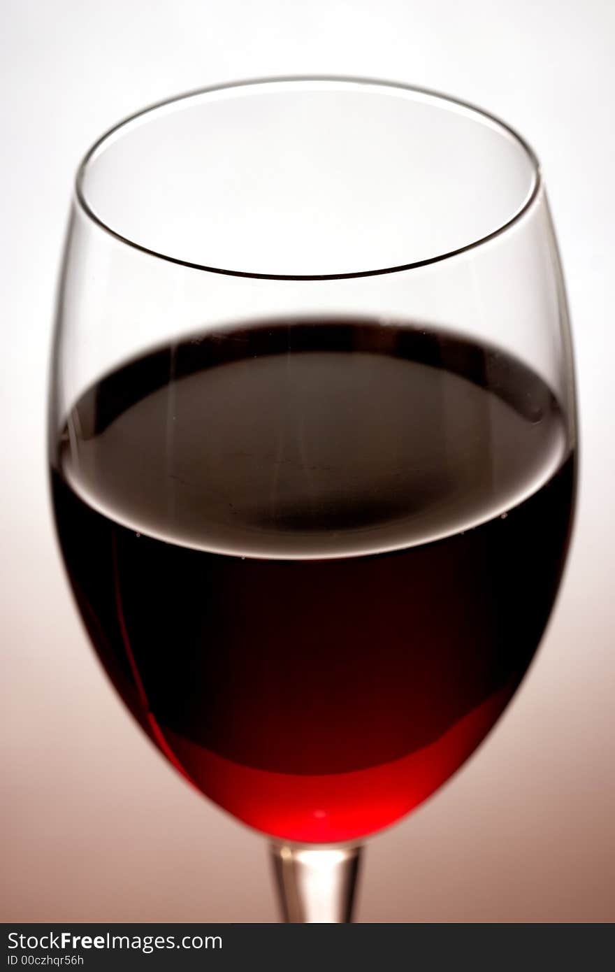 The close up of the red wine glass