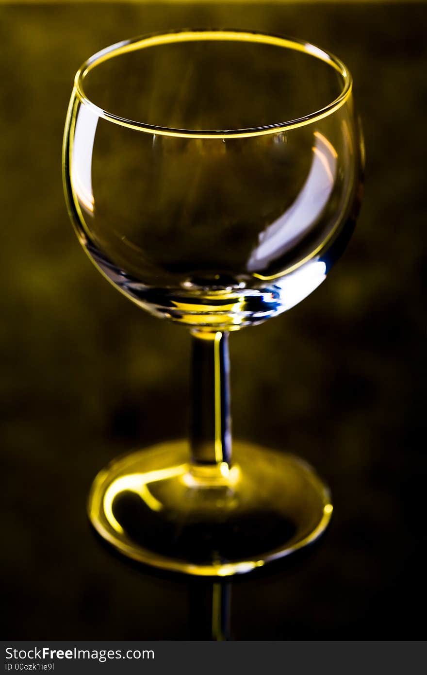 The close up of the wine glass on black