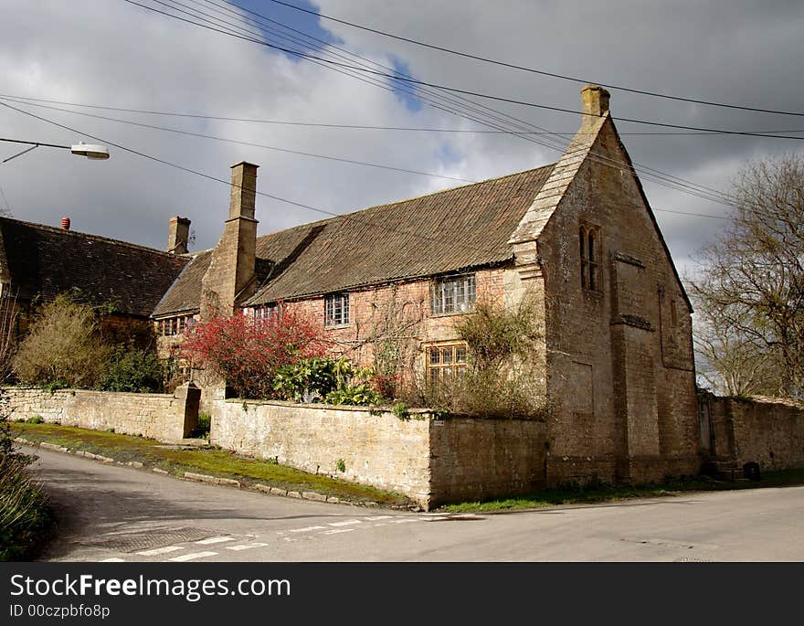 Winter sunshine on a Natural Stone Mullion windowed English Village House