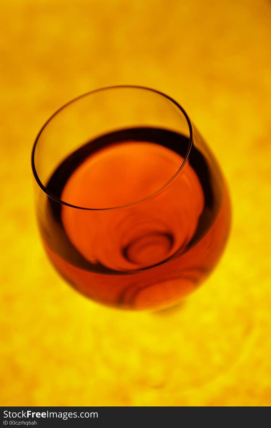 Glass With Red Cognac In Perspective