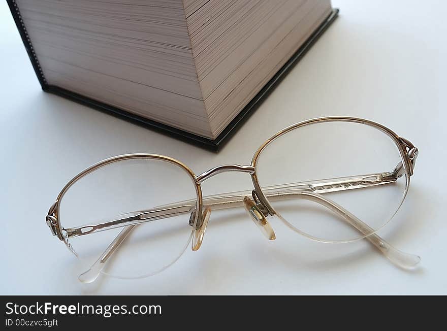 BIG BOOK AND GLASSES. BIG BOOK AND GLASSES