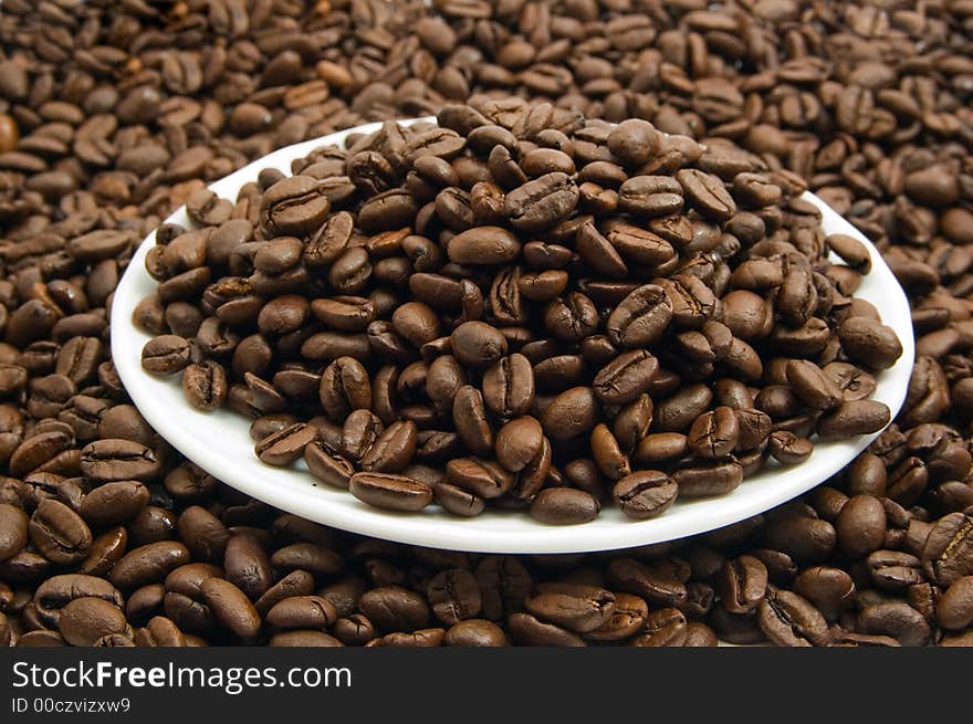 Saucer with coffee beans