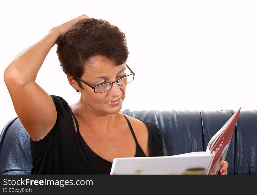 View of woman carried away by reading. View of woman carried away by reading