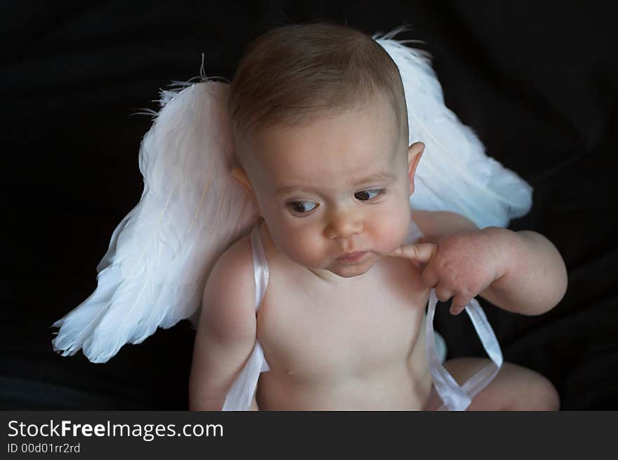 Image of baby wearing angel wings. Image of baby wearing angel wings