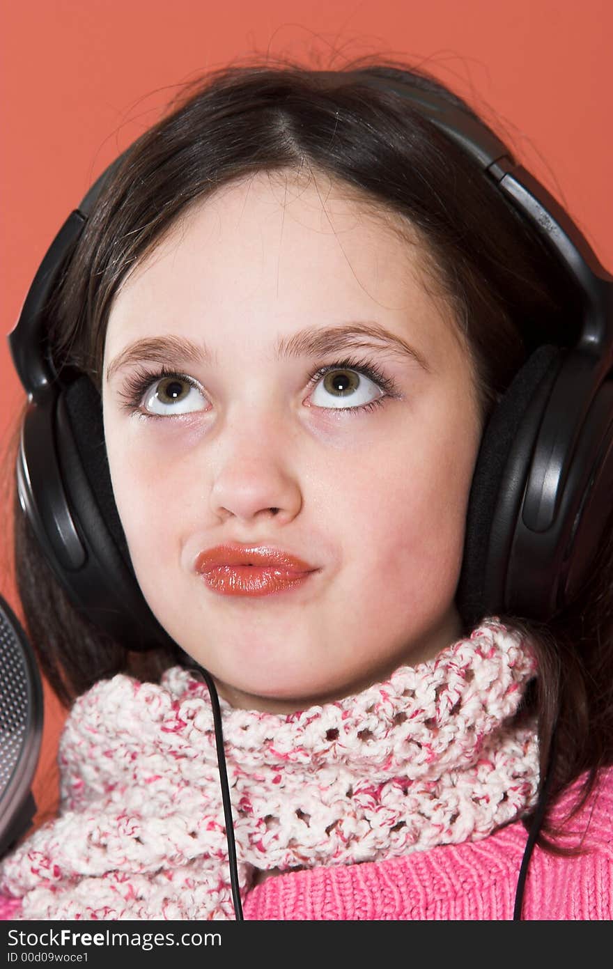 Pretty girl listening music in headphones