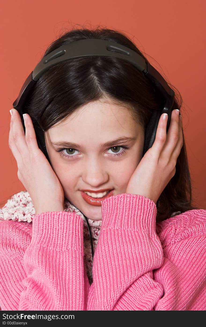 Pretty girl listening music in headphones