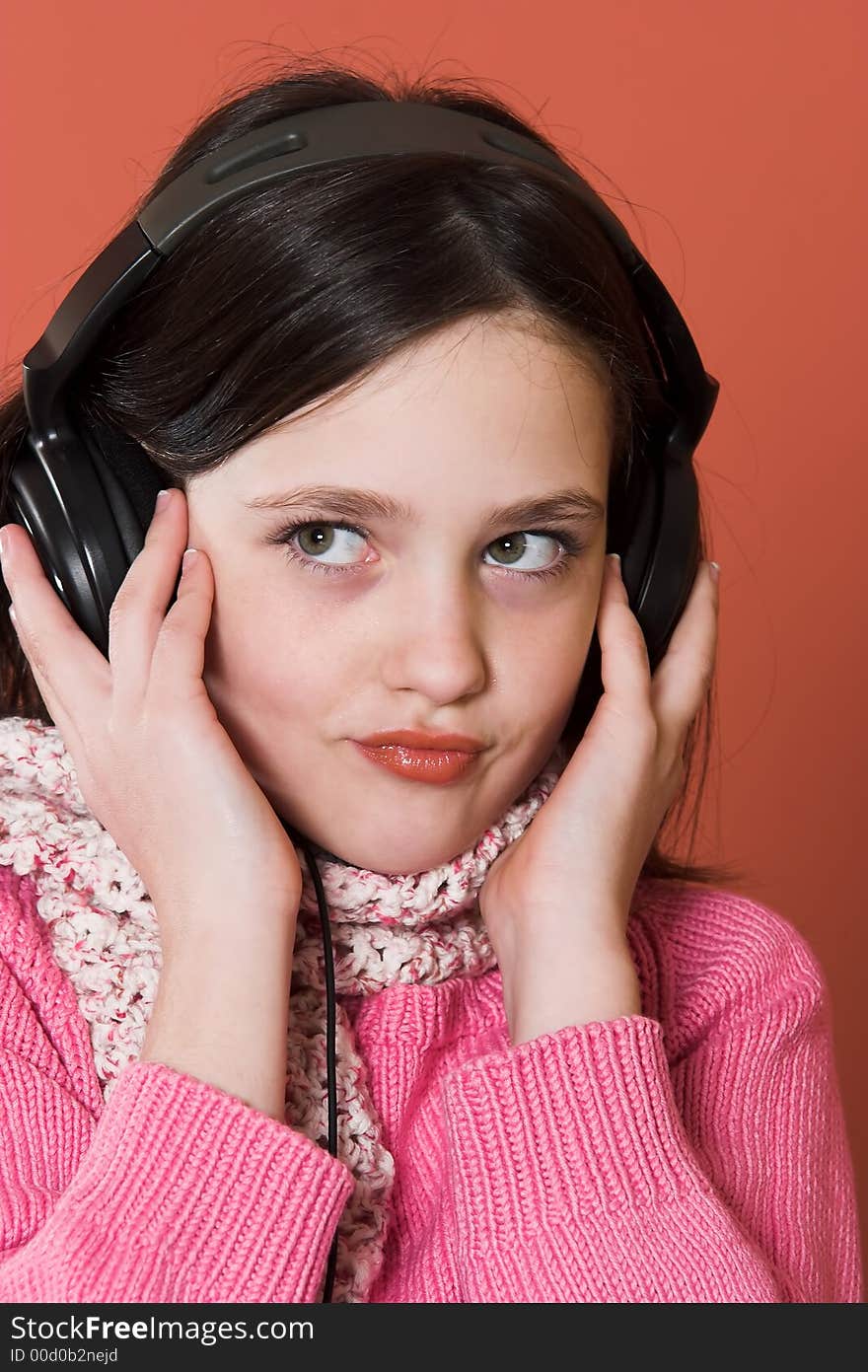 Pretty girl listening music in headphones