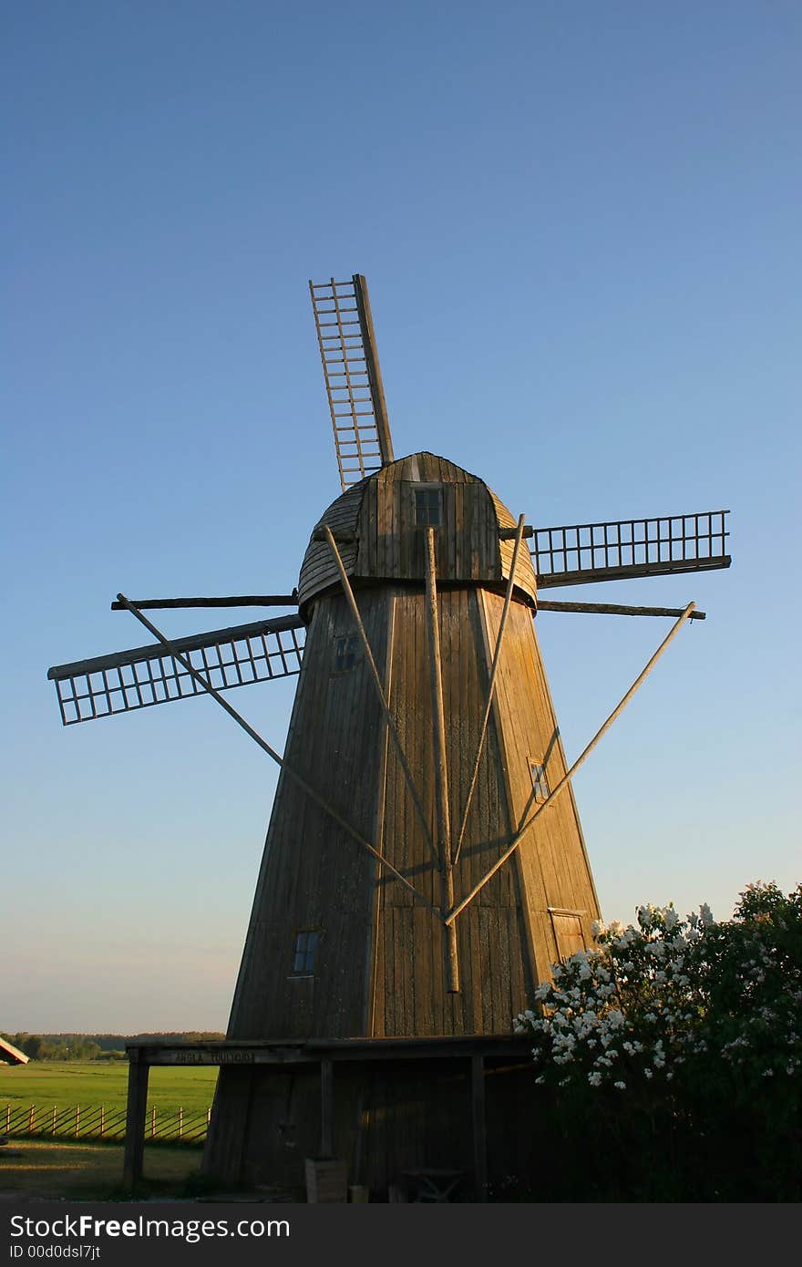 Old wooden windy  mill in village, Estonia. Old wooden windy  mill in village, Estonia