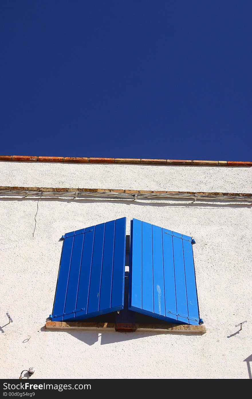 Typical blue window in the town of Cadaques, Catalonia, Spain, Europe. Typical blue window in the town of Cadaques, Catalonia, Spain, Europe