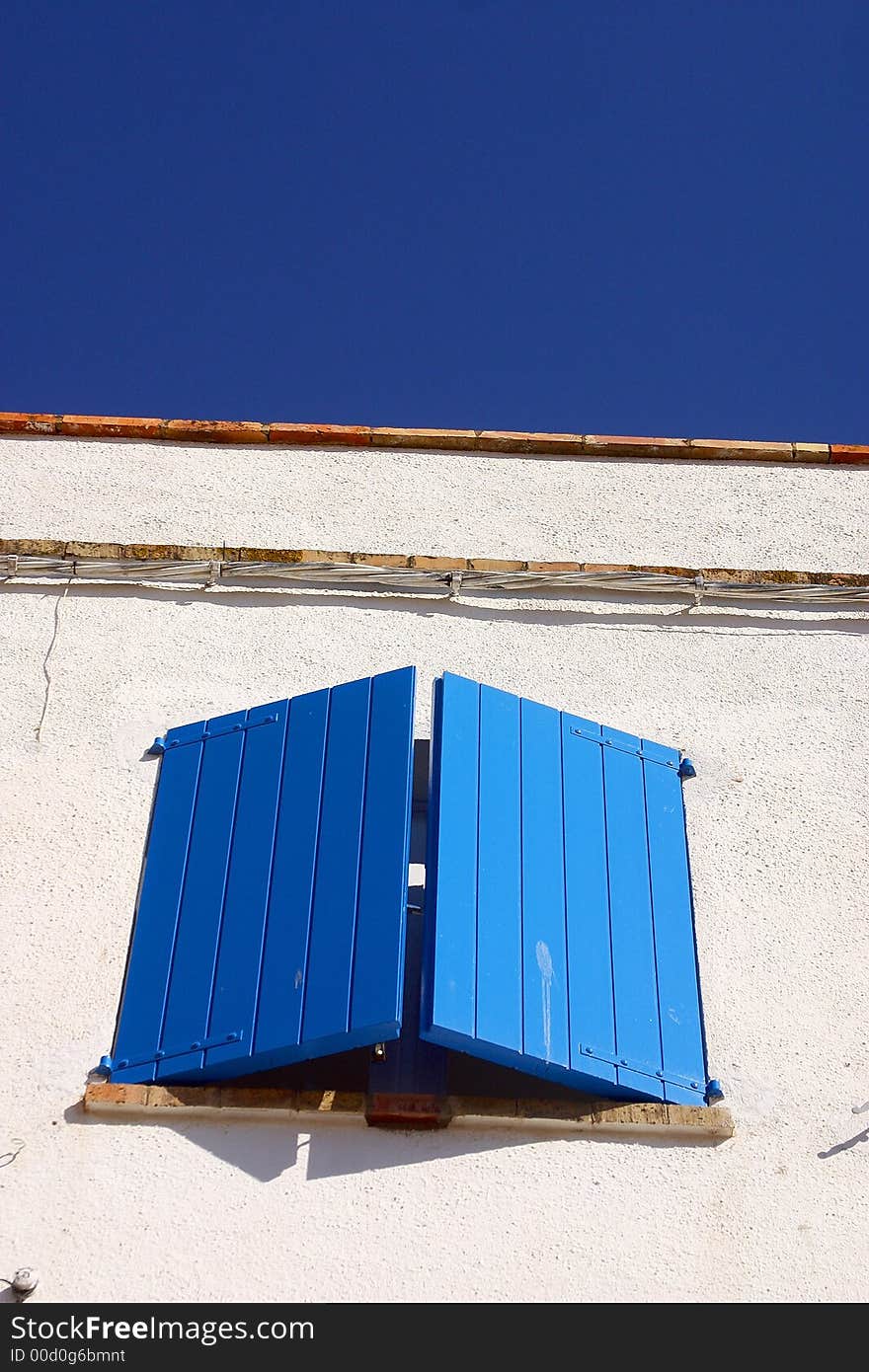 Typical blue window in the town of Cadaques, Catalonia, Spain, Europe. Typical blue window in the town of Cadaques, Catalonia, Spain, Europe