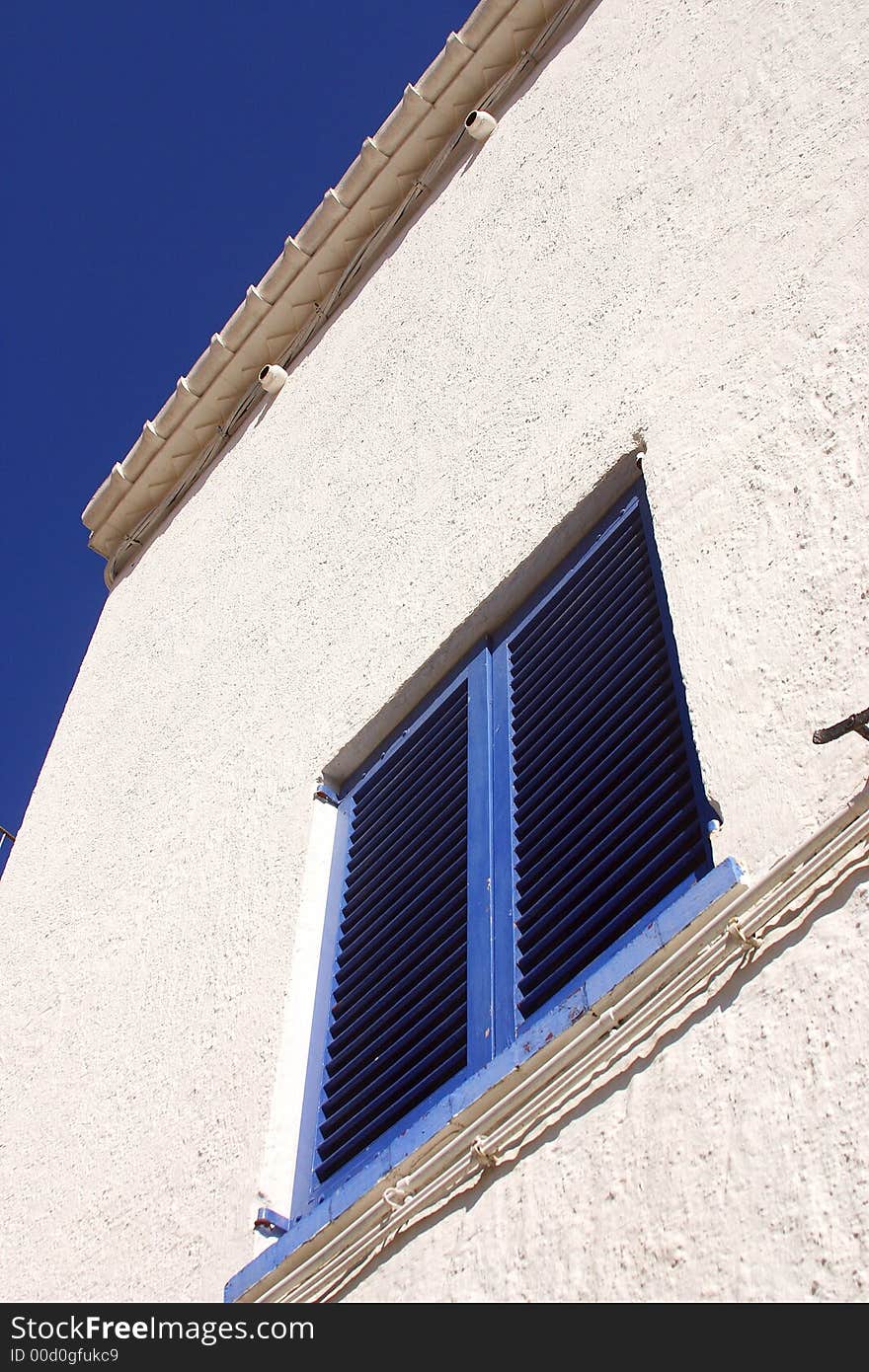 Typical blue window in the town of Cadaques, Catalonia, Spain, Europe. Typical blue window in the town of Cadaques, Catalonia, Spain, Europe