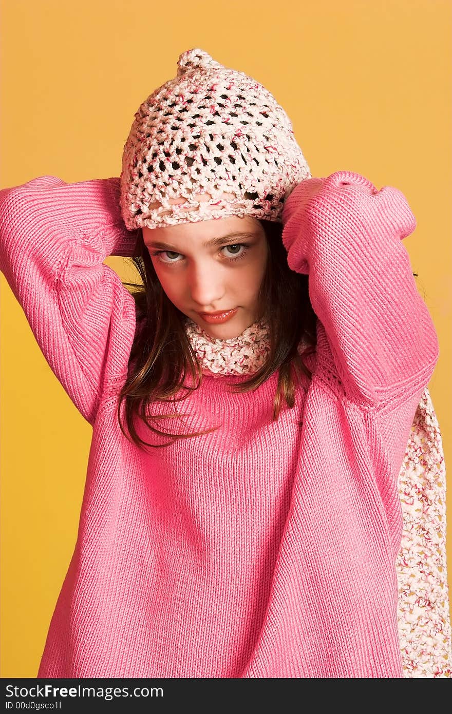 Portrait of pretty girl on yellow background