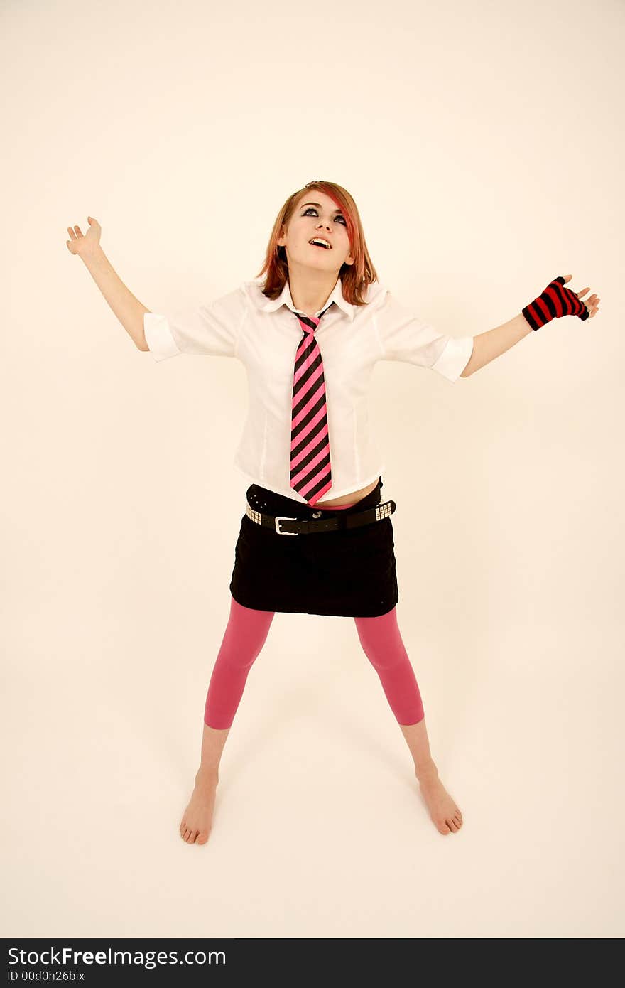 A schoolgirl looking up, dressed in a pink uniform. A schoolgirl looking up, dressed in a pink uniform