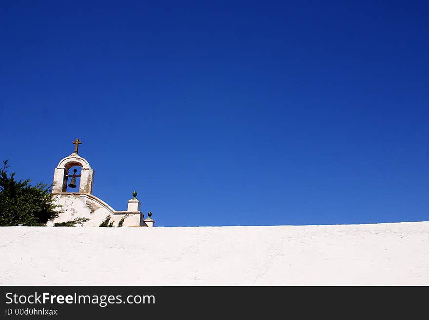 Tower with bell of a church in the town of Cadaques, Catalonia, Spain, Europe