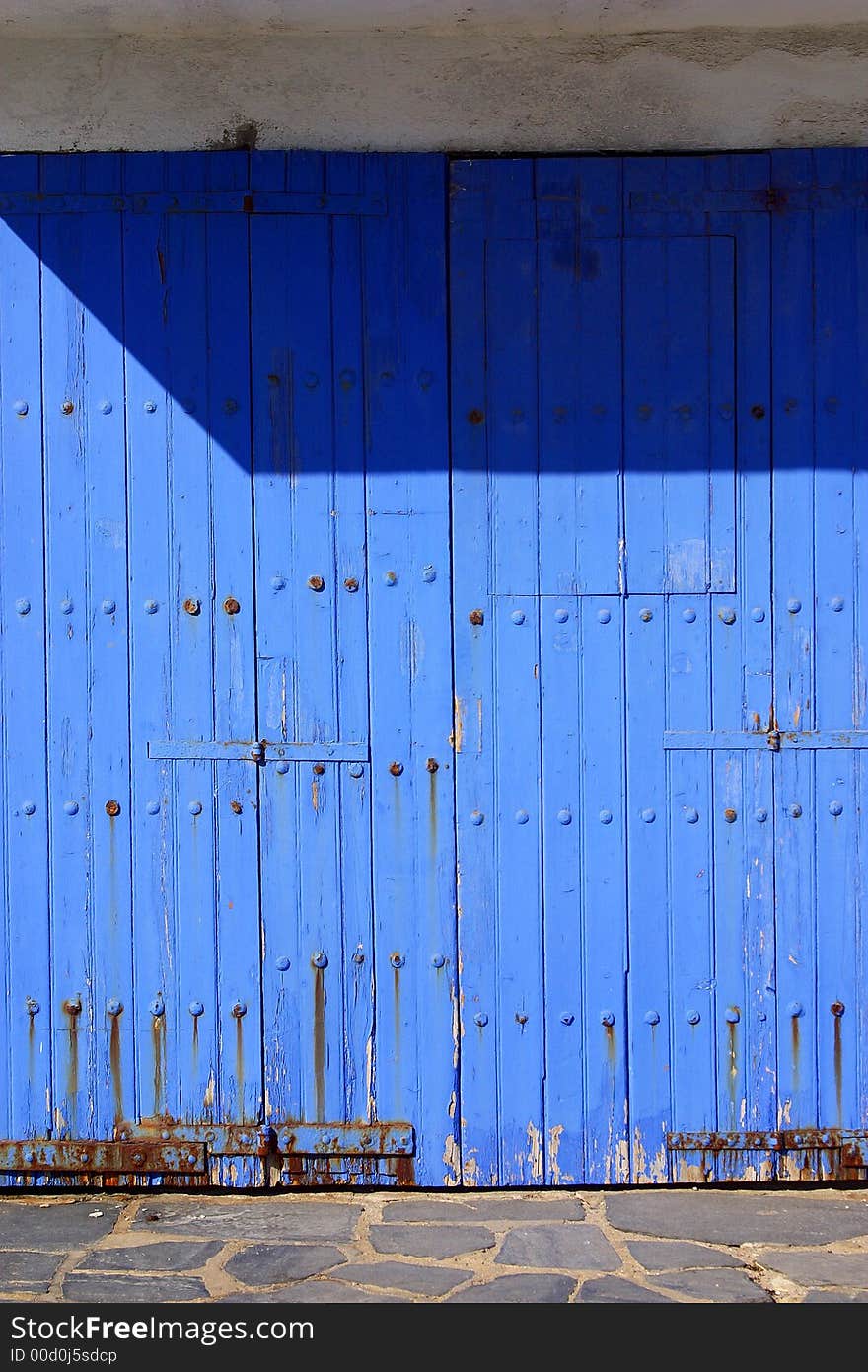 Blue wooden door of the town of Cadaques, Catalonia, Spain, Europe