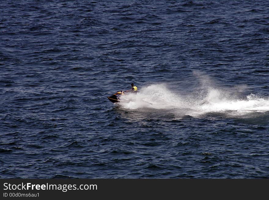 JetSki Rider On A Water Bike, Blue Ocean Surface On A Summer Day, Outdoor