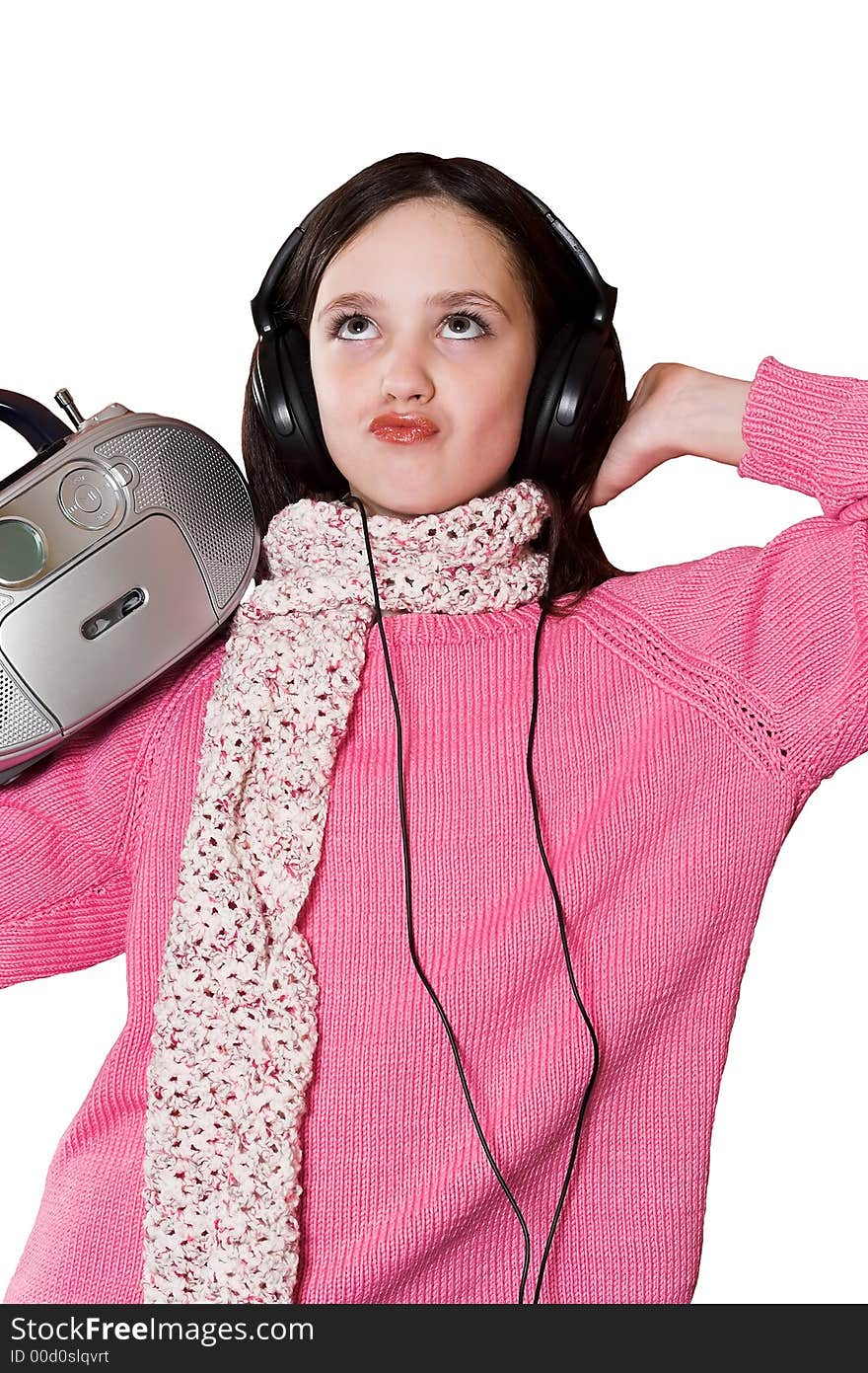 Pretty girl listening music with headphones and holding portable CD radio on white background