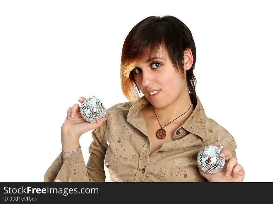 The young girl holds mirror spheres in hands