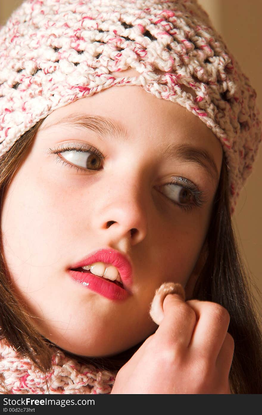 Pretty girl cleaning face with cotton