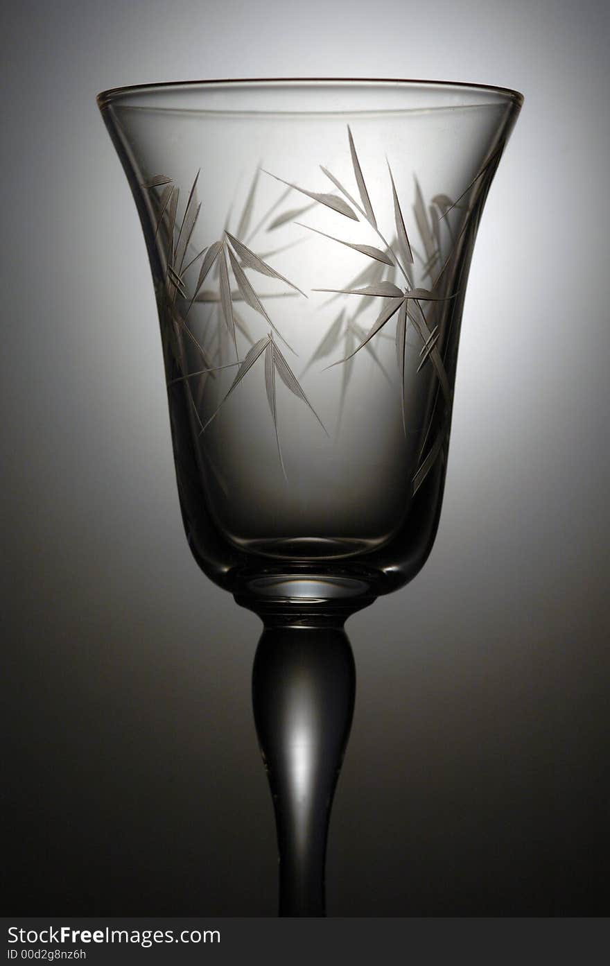 A very elegant cocktail glass. A low key image taken in a studio.