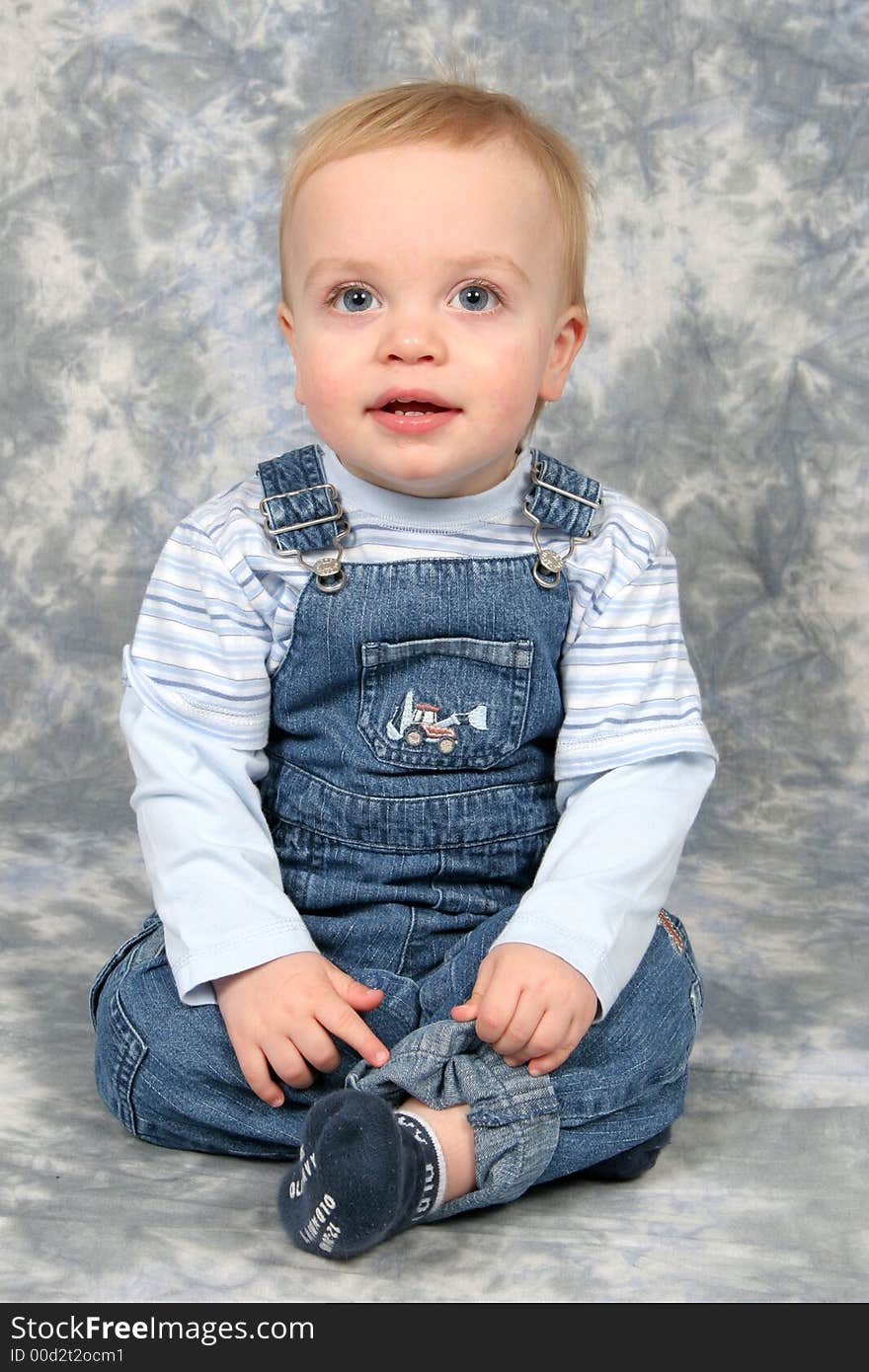 Little Boy Sitting in Studio