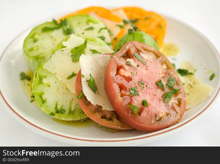 Heirloom Tomato Salad with shaved pecorino romano cheese and a drizzzle of olive oil salt and pepper. A healthy lunch, side dish, or appetizer,. Heirloom Tomato Salad with shaved pecorino romano cheese and a drizzzle of olive oil salt and pepper. A healthy lunch, side dish, or appetizer,