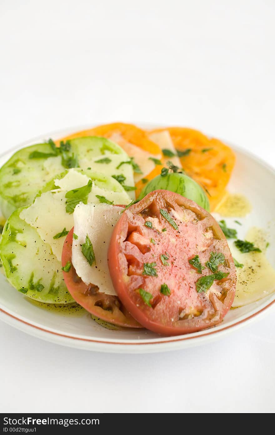 Heirloom Tomato Salad with shaved pecorino romano cheese and a drizzzle of olive oil salt and pepper. A healthy lunch, side dish, or appetizer,. Heirloom Tomato Salad with shaved pecorino romano cheese and a drizzzle of olive oil salt and pepper. A healthy lunch, side dish, or appetizer,