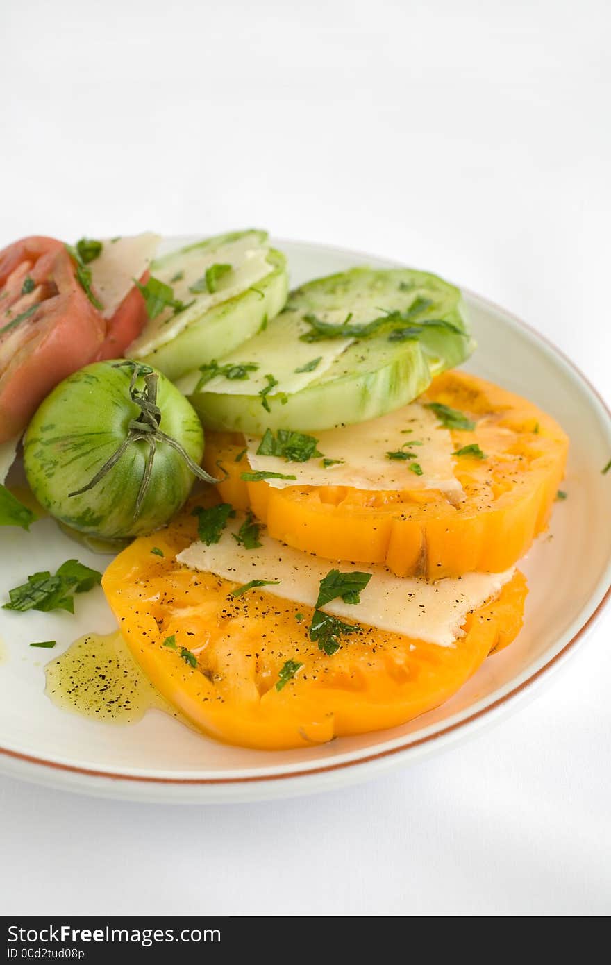 Heirloom Tomato Salad with shaved pecorino romano cheese and a drizzzle of olive oil salt and pepper. A healthy lunch, side dish, or appetizer,. Heirloom Tomato Salad with shaved pecorino romano cheese and a drizzzle of olive oil salt and pepper. A healthy lunch, side dish, or appetizer,