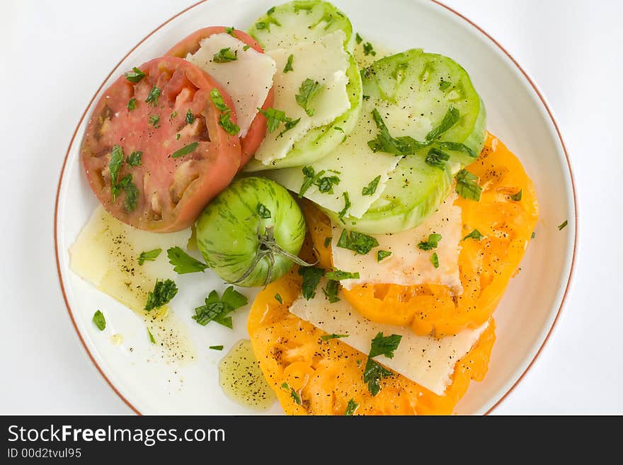 Heirloom Tomato Salad with shaved pecorino romano cheese and a drizzzle of olive oil salt and pepper. A healthy lunch, side dish, or appetizer,. Heirloom Tomato Salad with shaved pecorino romano cheese and a drizzzle of olive oil salt and pepper. A healthy lunch, side dish, or appetizer,