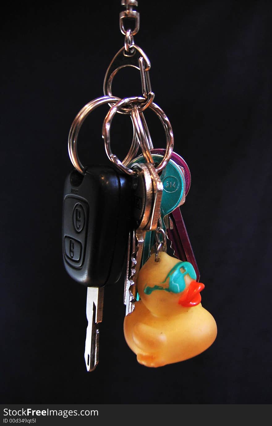 Carry-key with house key and car key and a little yellow duck