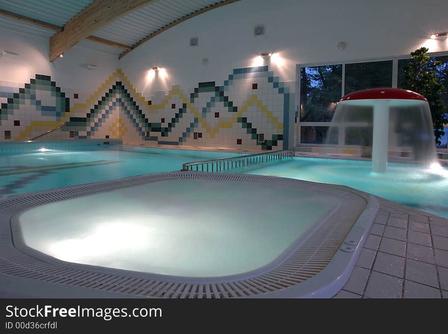 Swimming pool indoor, empty.