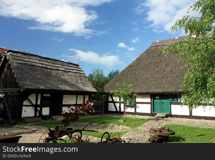 Traditional Polish checked houses, straw roofs. Traditional Polish checked houses, straw roofs.