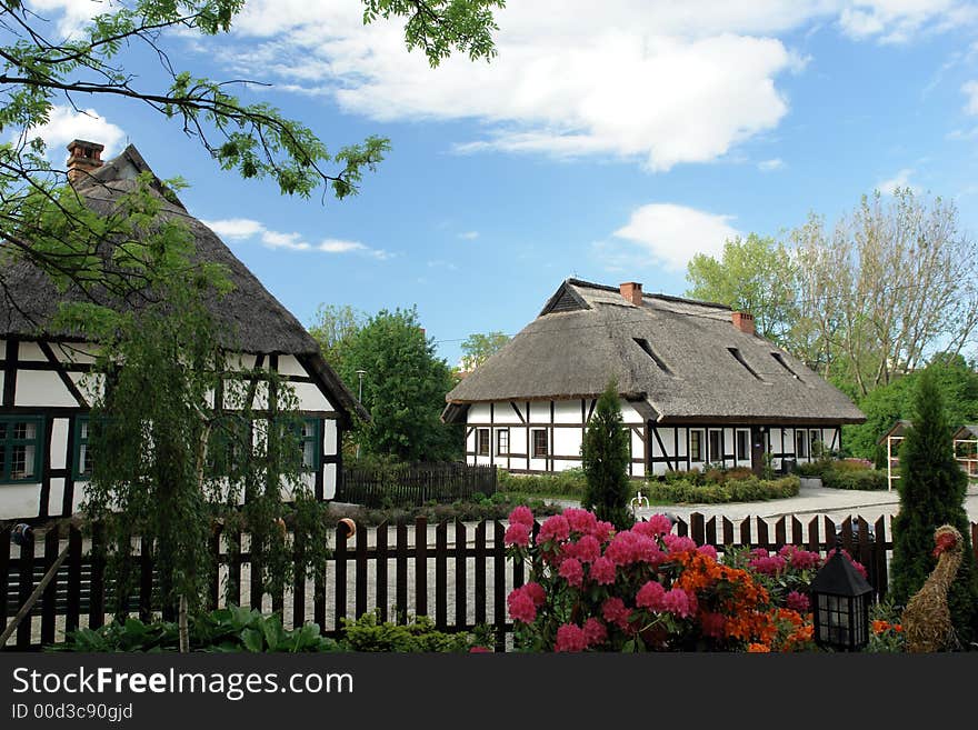 Traditional Polish checked houses, straw roofs. Traditional Polish checked houses, straw roofs.