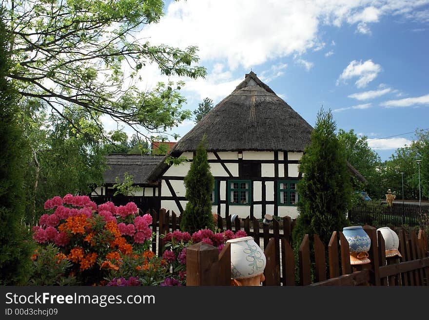 Traditional Polish checked houses, straw roofs. Traditional Polish checked houses, straw roofs.