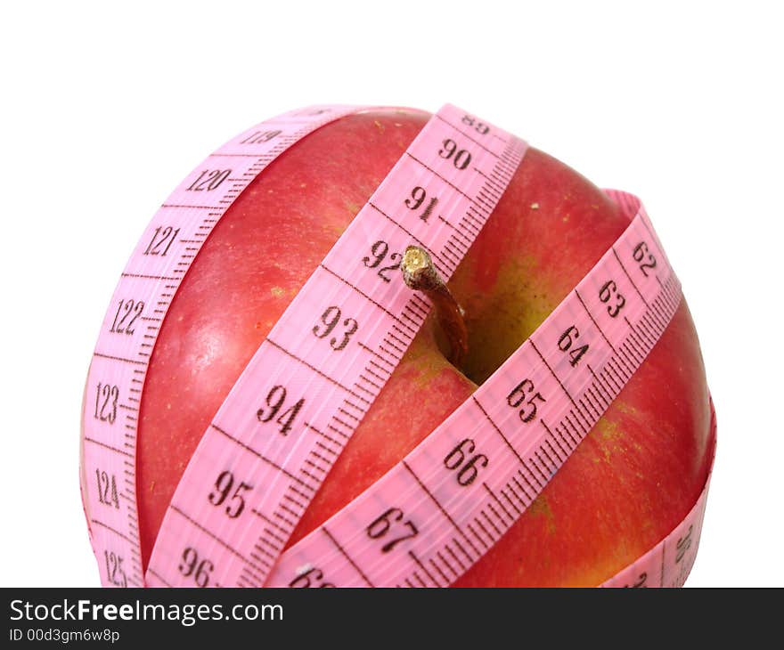 Apple with pink tape measure over white background (concept of h