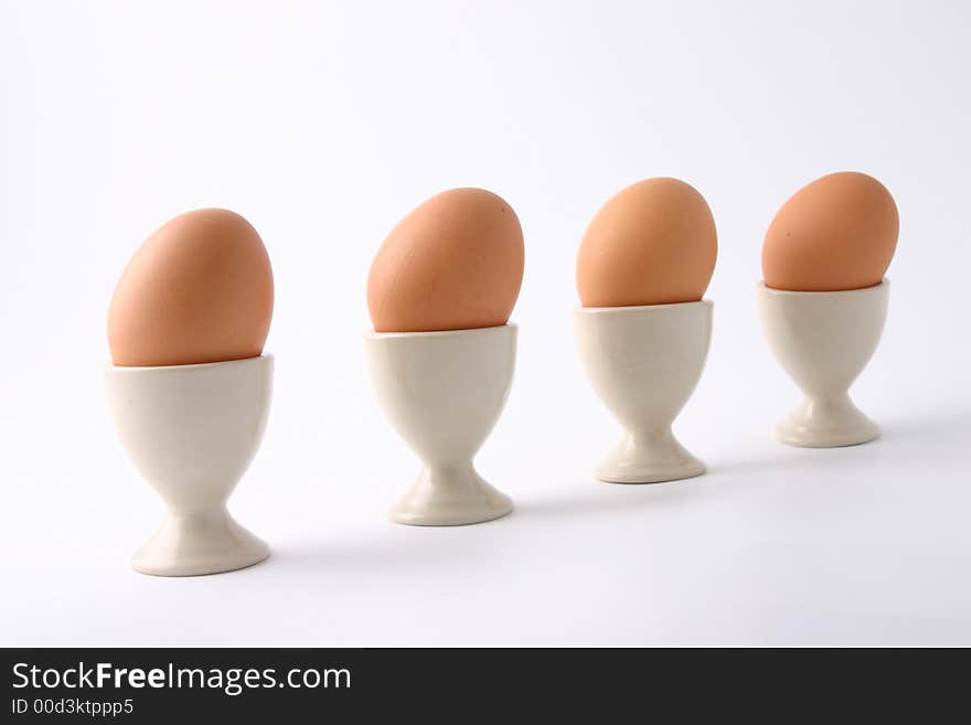 Brown eggs on white background