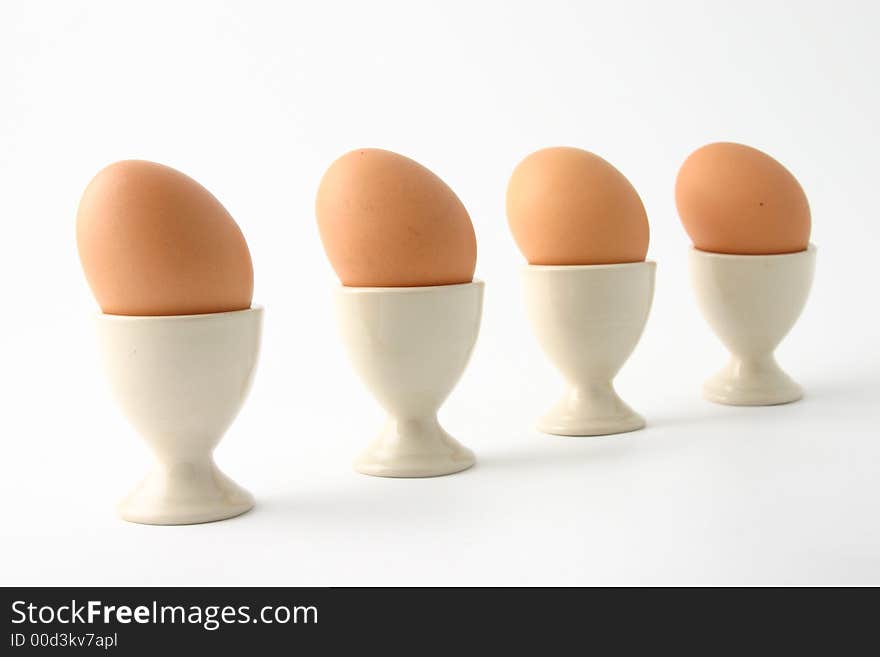 Brown eggs on white background