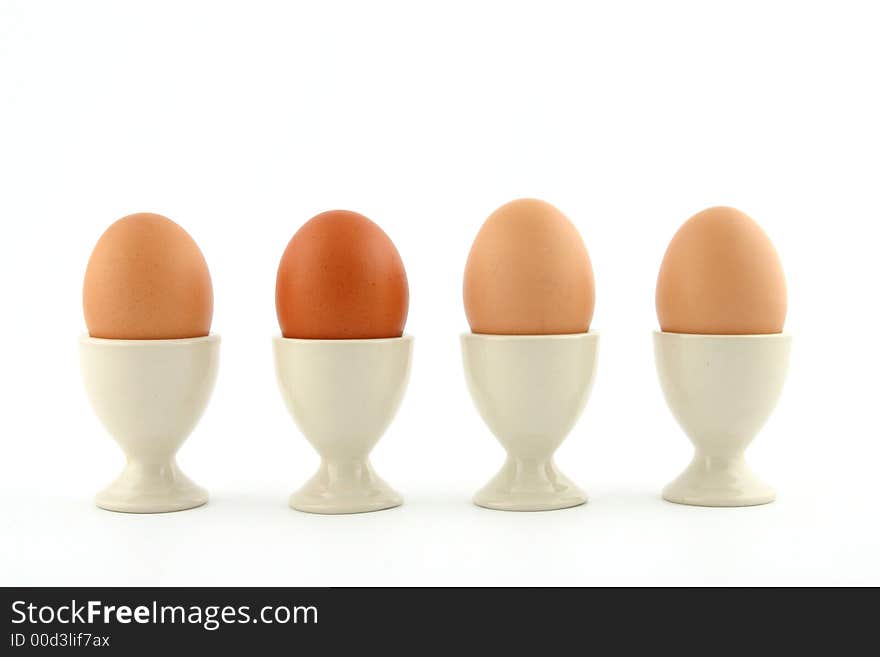 Brown eggs on white background