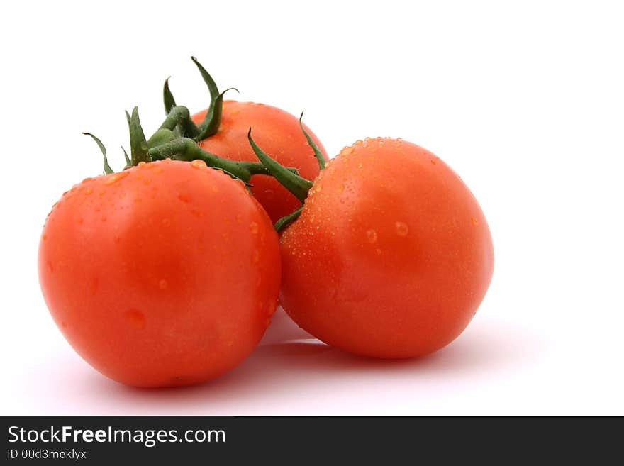 Fresh tomatoes on white background