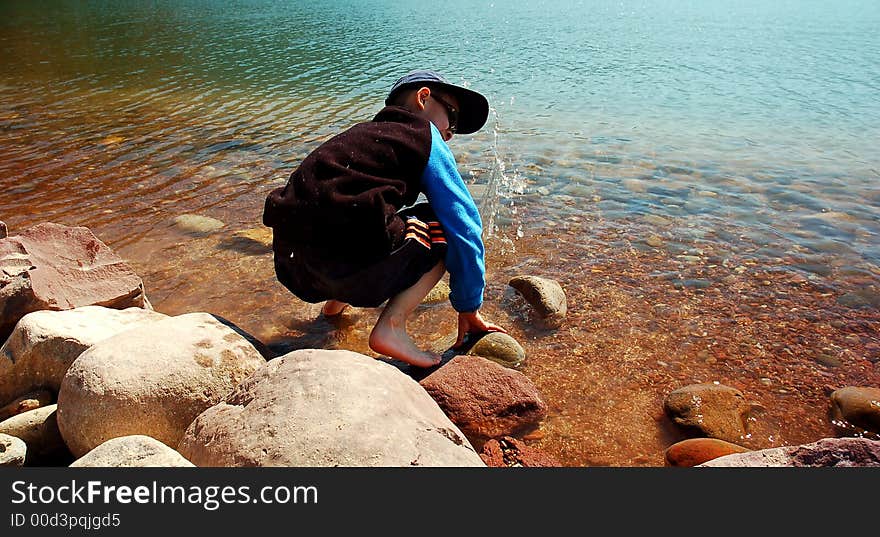 A boy play on the beach at Sichuan,west of China. A boy play on the beach at Sichuan,west of China