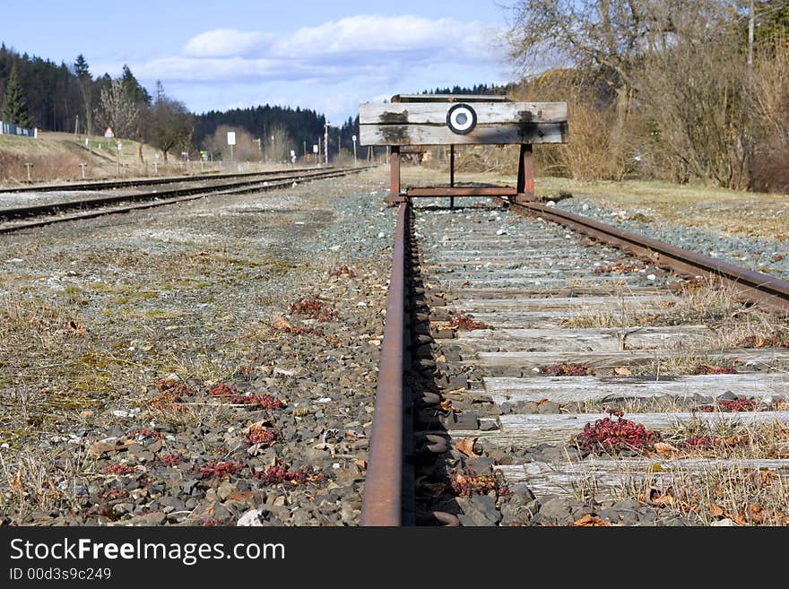 A photo of the end of a railway line (symbolic) shallow dof. A photo of the end of a railway line (symbolic) shallow dof