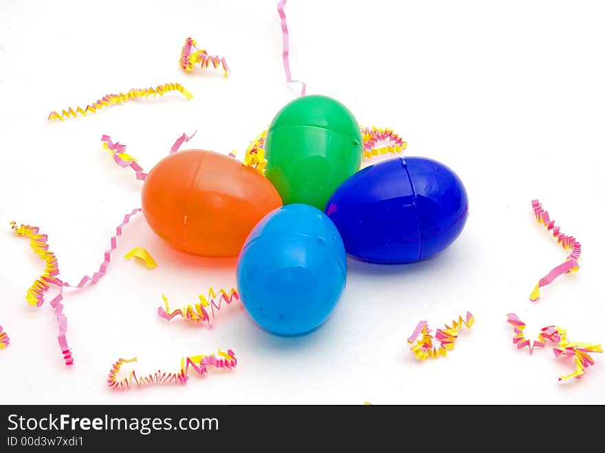 Colorful plastic eggs on a festive background