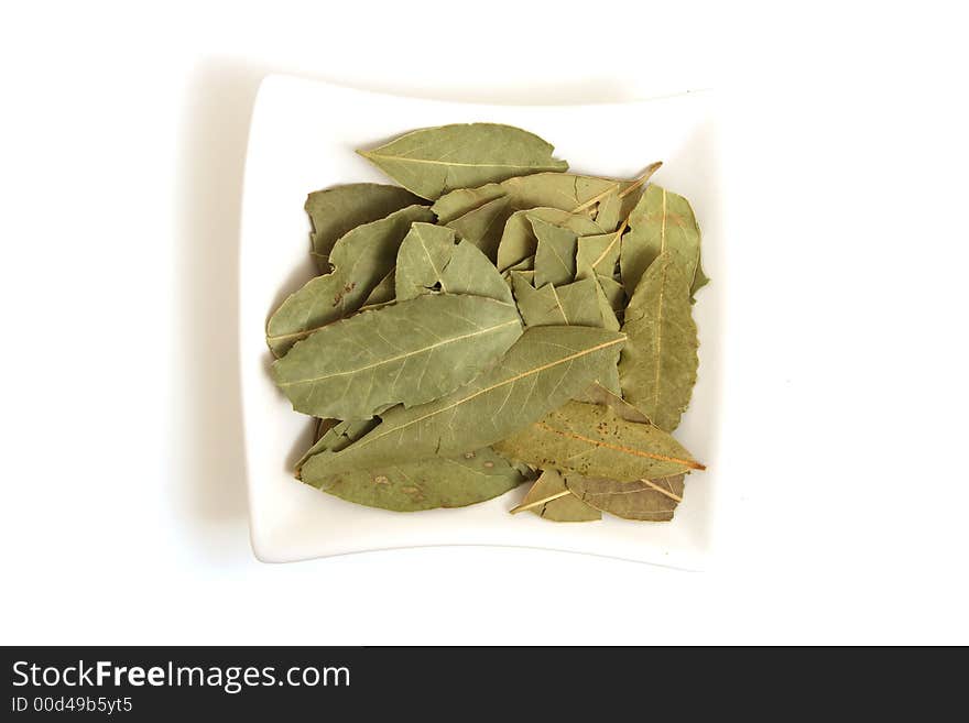 Bye leaves in square white bowl