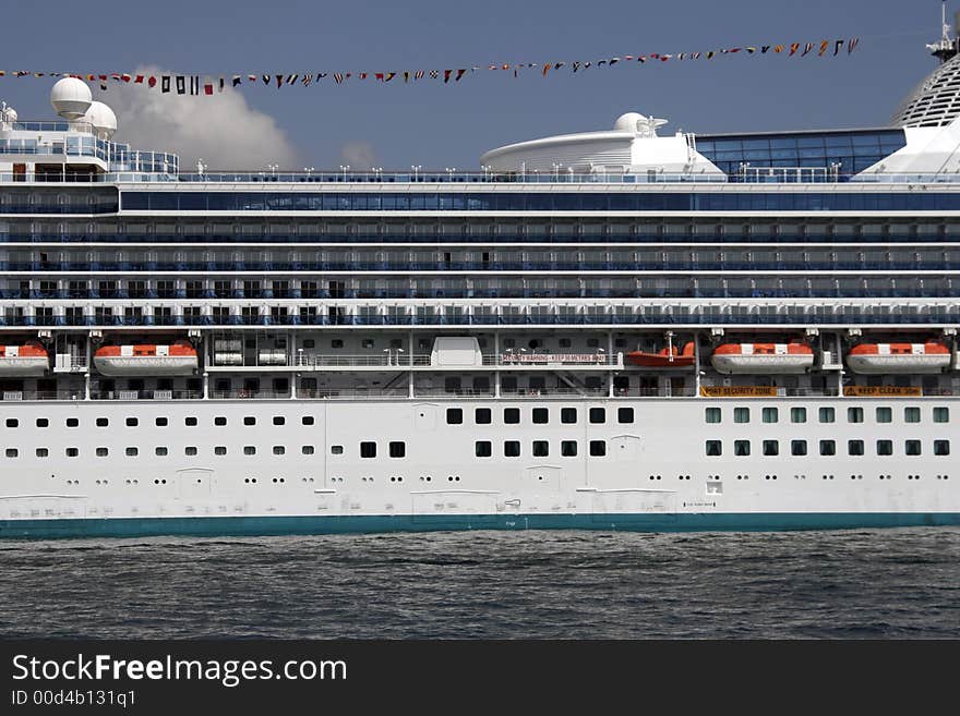 Center Part Of A Large White Cruise Ship, Cabins, Rescue Boats, Deck