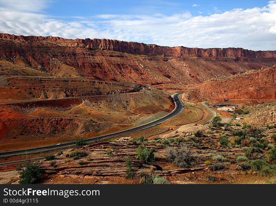 Road through canyons in Utah, near Arches National Park. Road through canyons in Utah, near Arches National Park.