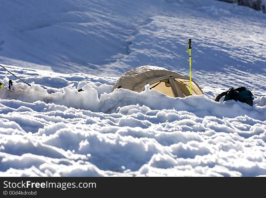 Yellow tent above the snow