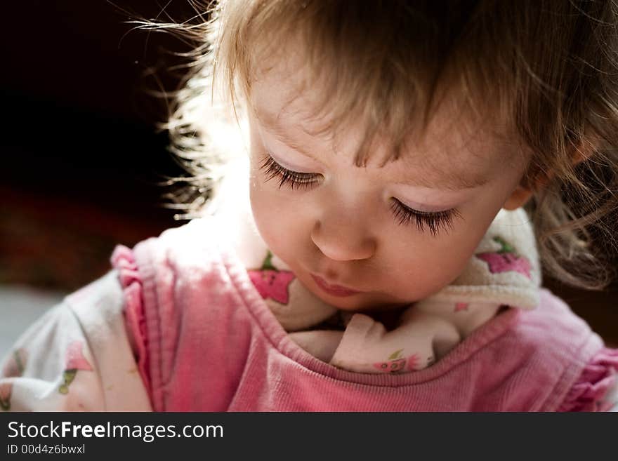 Portrait of cute little girl in the rays of sun. Portrait of cute little girl in the rays of sun