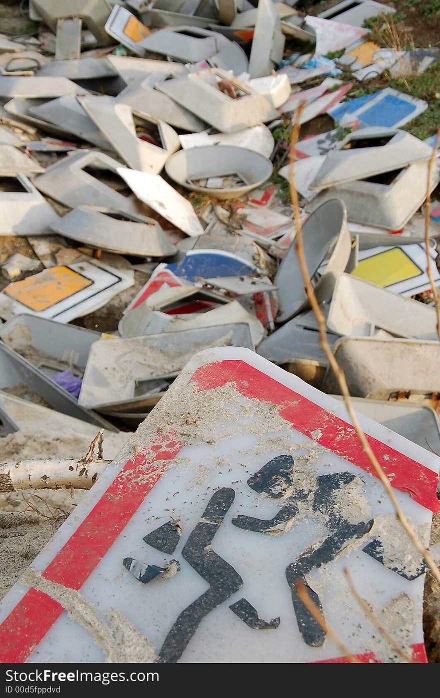 Small dump of the broken road-transport signs. Small dump of the broken road-transport signs