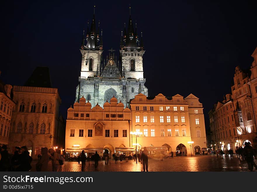 Nighttime shot of Our Lady Before Tyn looming over the lit Old Town Square in Prague. Nighttime shot of Our Lady Before Tyn looming over the lit Old Town Square in Prague